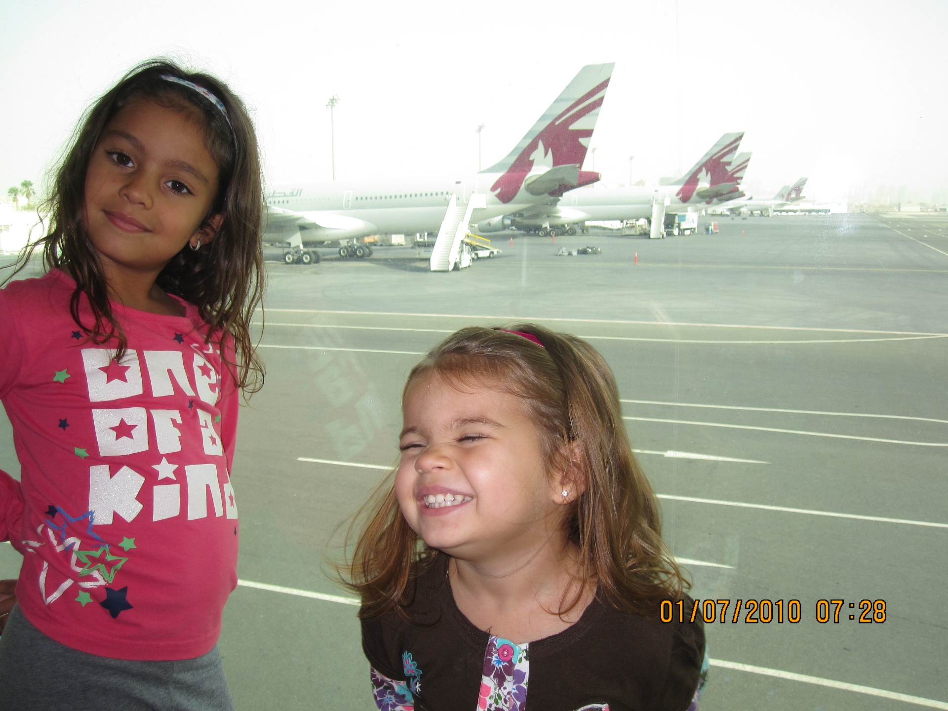 Childhood photo at Doha airport with Qatar Airways planes