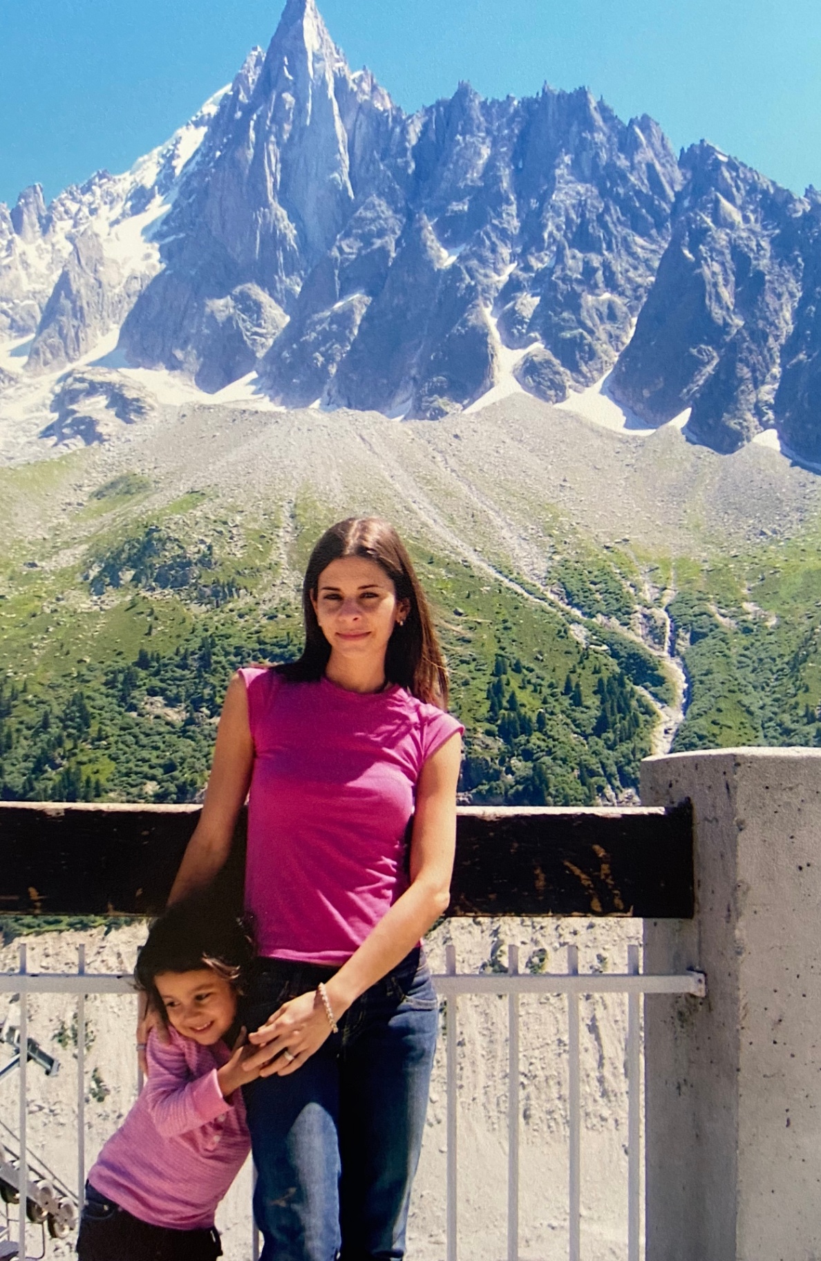 Mother and daughter in front of the French Alps
