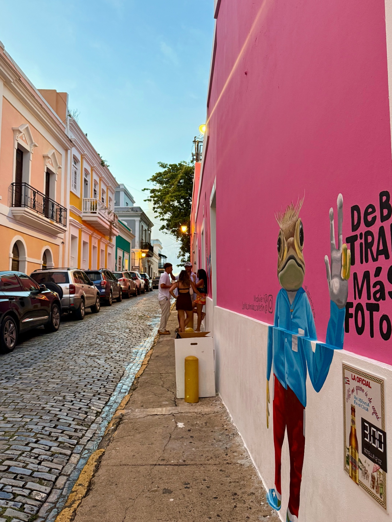 Cobblestone street and pink mural in Old San Juan